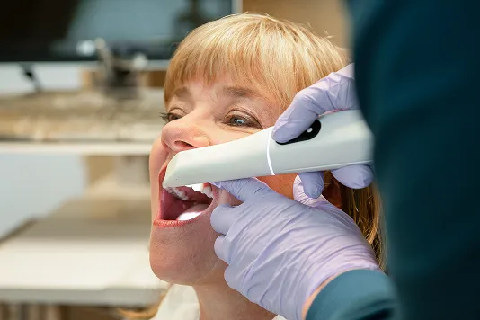 patient getting teeth scanned