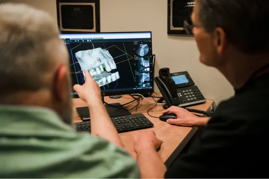 patient pointing at monitor screen