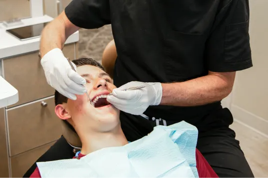 patient getting teeth exam