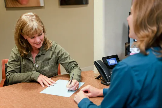 patient signing paper