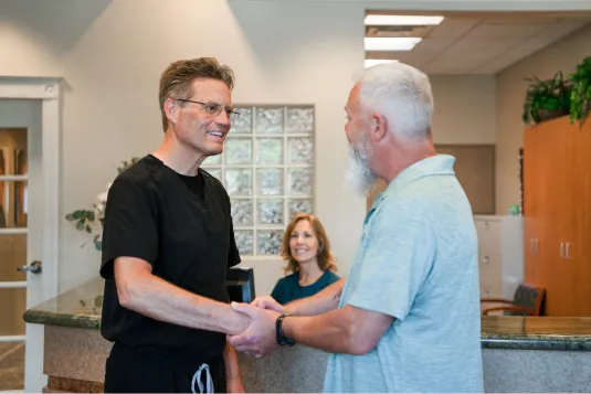 patient shaking doctors hand